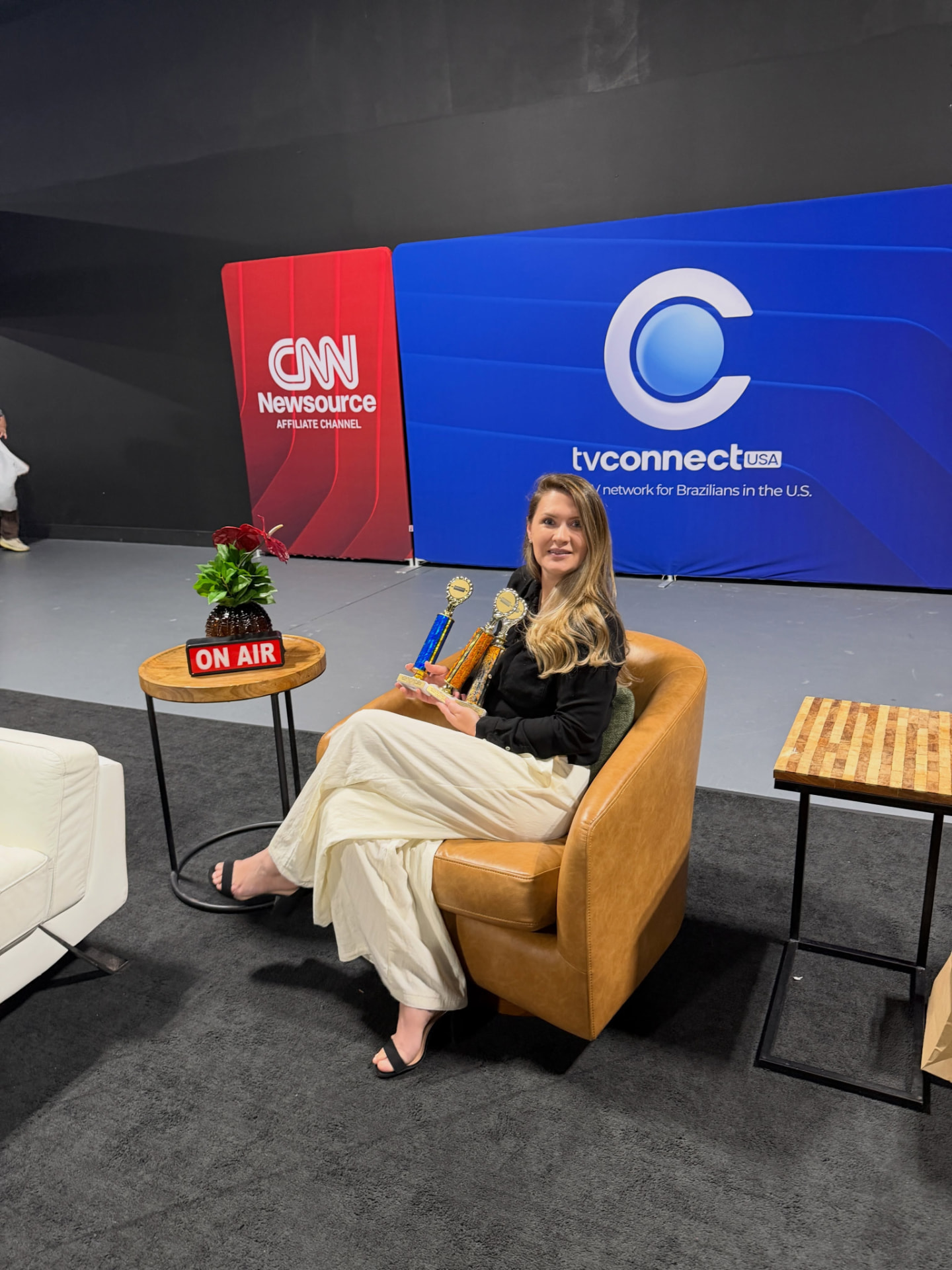 Elis seated on the TVConnect USA set